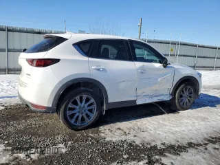 2021 Mazda CX-5 Grand Touring with VIN JM3KFBDM3M1305807, listed as a Copart auction lot 42713655 with 58,162 mi miles and Salvage Title. Bid and sale history available at DreamBid. Image 3.