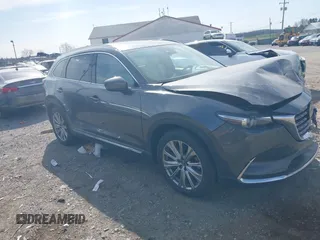 2021 Mazda CX-9 Signature with VIN JM3TCBEY5M0523199, listed as a IAAI auction lot 41916480 with 56,772 mi miles. Bid and sale history available at carsss.com. Image 1.