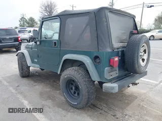 2000 Jeep Wrangler SE with VIN 1J4FA29P0YP728370, listed as a IAAI auction lot 41788463 with 186,995 mi miles. Bid and sale history available at carsss.com. Image 3.