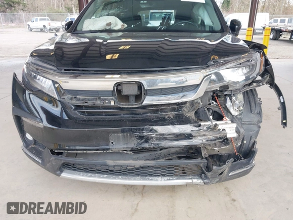 2021 Honda Pilot Elite with VIN 5FNYF6H04MB043014, listed as a IAAI auction lot 41826931 with 63,546 mi miles and . Bid and sale history available at DreamBid. Image 6.