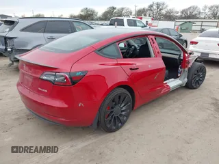 2022 Tesla Model 3 Performance with VIN 5YJ3E1ECXNF329188, listed as a IAAI auction lot 41308371 with 15,220 mi miles and . Bid and sale history available at DreamBid. Image 4.