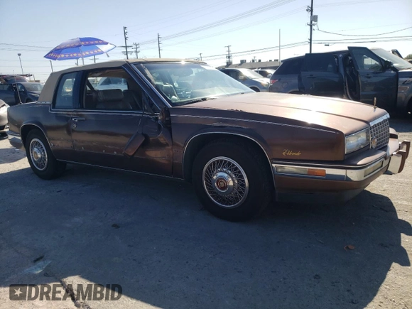 1988 Cadillac Eldorado z VIN 1G6EL115XJU611177, wystawiony jako Copart lot #46526855 z przebiegiem 122 780 mil mil oraz Szkoda całkowita • Salvage title. Historia ofert i sprzedaży dostępna na DreamBid. Obrazek 4.