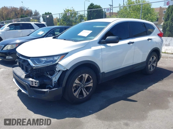 2019 Honda CR-V LX with VIN 2HKRW5H33KH407463, listed as a IAAI auction lot 42034584 with 85,454 mi miles and . Bid and sale history available at DreamBid. Image 2.