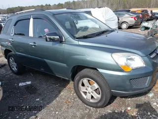 2009 Kia Sportage LX with VIN KNDJE723197563651, listed as a IAAI auction lot 41477610 with 168,797 mi miles. Bid and sale history available at carsss.com. Image 1.