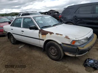 1991 Toyota Camry z VIN 4T1SV24E5MU355011, wystawiony jako Copart lot #51021185 z przebiegiem 135 881 mil mil oraz Czysty tytuł • Clean title. Historia ofert i sprzedaży dostępna na DreamBid. Obrazek 4.