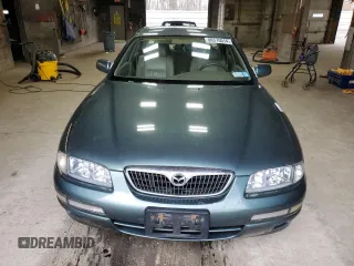 2000 Mazda Millenia z VIN JM1TA2212Y1610919, wystawiony jako Copart lot #80375014 z przebiegiem 127 938 mil mil oraz Szkody całkowita. Historia ofert i sprzedaży dostępna na DreamBid. Obrazek 5.