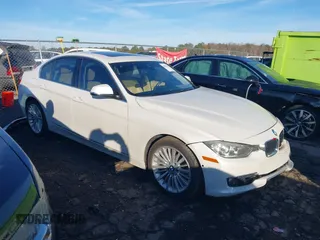 2015 BMW 3 Series 328i with VIN WBA3A5G53FNS87111, listed as a IAAI auction lot 40961587 with 122,767 mi miles. Bid and sale history available at carsss.com. Image 1.