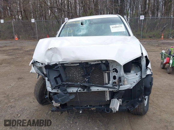 2022 Toyota Tacoma SR with VIN 3TYAX5GN3NT062077, listed as a IAAI auction lot 41886531 with 58,687 mi miles and . Bid and sale history available at DreamBid. Image 6.
