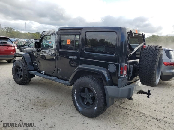 2011 Jeep Wrangler Unlimited Sahara with VIN 1J4HA5H19BL623123, listed as a Copart auction lot 72860734 with 0 mi miles and Non Repairable. Bid and sale history available at carsss.com. Image 2.