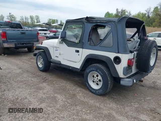 1998 Jeep Wrangler Sport with VIN 1J4FY19S0WP779147, listed as a IAAI auction lot 42045723 with 205,822 mi miles. Bid and sale history available at carsss.com. Image 3.