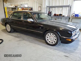 2001 Jaguar XJ with VIN SAJDA25B01MF26440, listed as a Copart auction lot 83933224 with 124,873 mi miles and Clean Title. Bid and sale history available at DreamBid. Image 4.