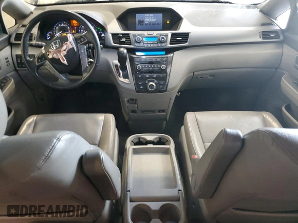 2012 Honda Odyssey Touring with VIN 5FNRL5H98CB028309, listed as a Copart auction lot 57663485 with 233,921 mi miles and Salvage title. Bid and sale history available at DreamBid. Image 8.