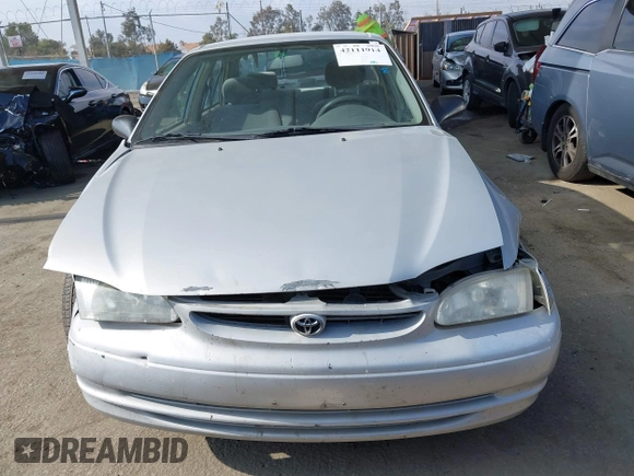 2000 Toyota Corolla VE with VIN 1NXBR12E6YZ393077, listed as a IAAI auction lot 42111914 with 181,056 mi miles and . Bid and sale history available at DreamBid. Image 13.
