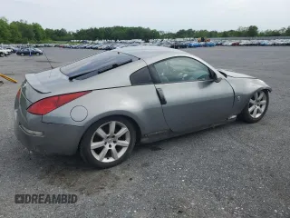 2005 Nissan 350Z Touring z VIN JN1AZ34E05M654954, wystawiony jako Copart lot #57591085 z przebiegiem Nie podano mil oraz Tytuł czysty. Historia ofert i sprzedaży dostępna na DreamBid. Obrazek 3.