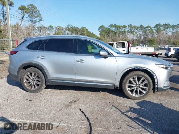 2017 Mazda CX-9 Grand Touring with VIN JM3TCADY5H0138176, listed as a IAAI auction lot 41458610 with 114,664 mi miles and . Bid and sale history available at DreamBid. Image 13.