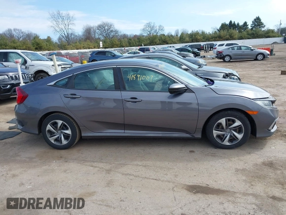2019 Honda Civic LX with VIN 19XFC2F61KE037495, listed as a IAAI auction lot 41891007 with 90,262 mi miles and . Bid and sale history available at DreamBid. Image 13.