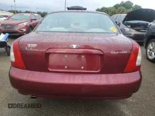 1999 Daewoo Nubira CDX z VIN KLAJB52Z5XK256700, wystawiony jako Copart lot #75085934 z przebiegiem Nie podano mil oraz Szkody całkowita. Historia ofert i sprzedaży dostępna na DreamBid. Obrazek 6.
