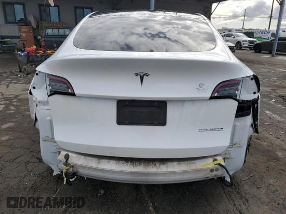 2021 Tesla Model Y Performance with VIN 5YJYGDEF4MF201815, listed as a Copart auction lot 42453075 with 76,888 mi miles and Salvage Title. Bid and sale history available at DreamBid. Image 6.