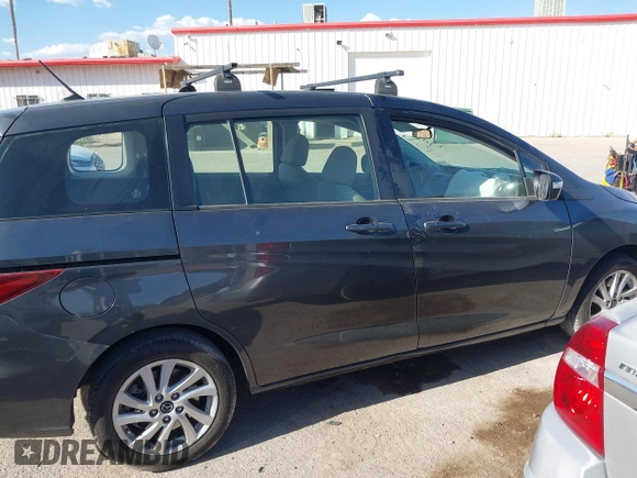2013 Mazda 5 Sport with VIN JM1CW2BL4D0145725, listed as a IAAI auction lot 42190177 with 143,209 mi miles and . Bid and sale history available at DreamBid. Image 13.