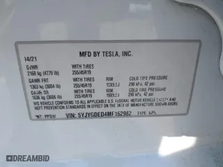 2021 Tesla Model Y Standard Range with VIN 5YJYGDED4MF162982, listed as a IAAI auction lot 41378674 with 60,267 mi miles. Bid and sale history available at carsss.com. Image 9.