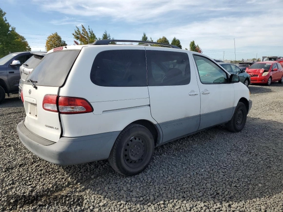 2001 Toyota Sienna LE with VIN 4T3ZF13C61U362980, listed as a Copart auction lot 71986484 with 188,556 mi miles and Salvage Title. Bid and sale history available at carsss.com. Image 3.