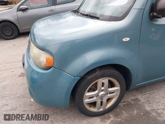 2010 Nissan Cube S z VIN JN8AZ2KRXAT170470, wystawiony jako IAAI lot #41751544 z przebiegiem 108 437 mil mil oraz . Historia ofert i sprzedaży dostępna na DreamBid. Obrazek 15.