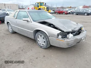 2000 Cadillac Eldorado z VIN 1G6EL12Y9YU184545, wystawiony jako IAAI lot #40993392 z przebiegiem 51 983 mil mil oraz . Historia ofert i sprzedaży dostępna na DreamBid. Obrazek 1.