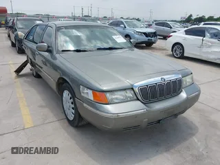 1999 Mercury Grand Marquis LS z VIN 2MEFM75W6XX668173, wystawiony jako IAAI lot #42160521 z przebiegiem 212 552 mil mil oraz . Historia ofert i sprzedaży dostępna na DreamBid. Obrazek 1.