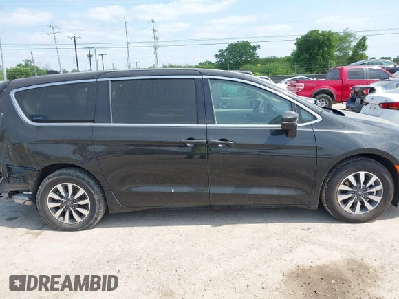 2023 Chrysler Pacifica Hybrid Touring L with VIN 2C4RC1L75PR592251, listed as a IAAI auction lot 42037873 with 44,428 mi miles and . Bid and sale history available at DreamBid. Image 13.