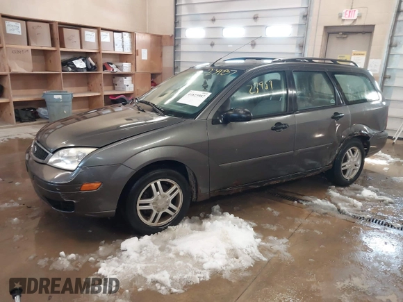 2005 Ford Focus SE with VIN 1FAFP36N45W158796, listed as a IAAI auction lot 41823987 with 145,803 mi miles and . Bid and sale history available at carsss.com. Image 2.