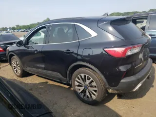 2020 Ford Escape Titanium z VIN 1FMCU9J97LUB25055, wystawiony jako Copart lot #60326945 z przebiegiem 78 711 mil mil oraz Szkoda całkowita • Salvage title. Historia ofert i sprzedaży dostępna na DreamBid. Obrazek 2.