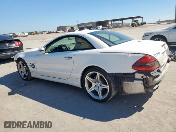 2009 Mercedes-Benz SL 550 with VIN WDBSK71F69F147589, listed as a Copart auction lot 65976995 with 77,387 mi miles and Salvage title. Bid and sale history available at DreamBid. Image 2.