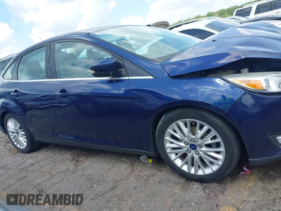 2016 Ford Focus Titanium z VIN 1FADP3J20GL208439, wystawiony jako IAAI lot #42145938 z przebiegiem 135 522 mil mil oraz . Historia ofert i sprzedaży dostępna na DreamBid. Obrazek 13.