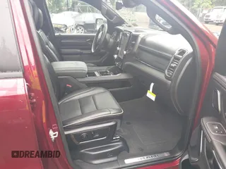 2023 Ram 1500 Limited with VIN 1C6SRFHM2PN509939, listed as a IAAI auction lot 42514018 with 31,669 mi miles and . Bid and sale history available at DreamBid. Image 5.