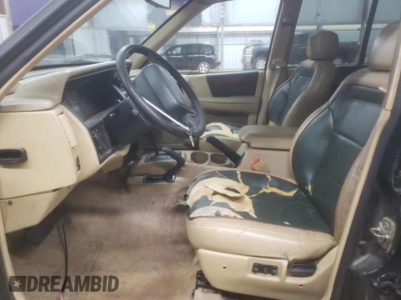 1995 Jeep Grand Cherokee Limited z VIN 1J4GZ78S7SC766726, wystawiony jako Copart lot #84909134 z przebiegiem 174 256 mil mil oraz Szkoda całkowita • Salvage title. Historia ofert i sprzedaży dostępna na DreamBid. Obrazek 7.