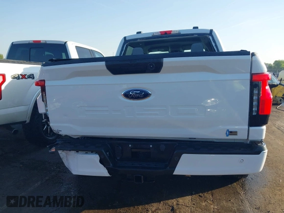 2023 Ford F-150 Lightning Pro with VIN 1FTVW1EL6PWG34059, listed as a IAAI auction lot 42010900 with 20,759 mi miles and . Bid and sale history available at DreamBid. Image 16.