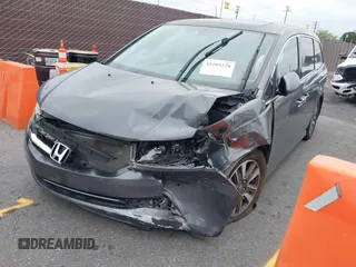 2014 Honda Odyssey Touring with VIN 5FNRL5H97EB114634, listed as a IAAI auction lot 42105220 with Not Provided miles and . Bid and sale history available at carsss.com. Image 2.
