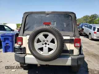 2011 Jeep Wrangler Sahara z VIN 1J4AA5D10BL528862, wystawiony jako Copart lot #53488515 z przebiegiem 198 865 mil mil oraz Szkoda całkowita • Salvage title. Historia ofert i sprzedaży dostępna na DreamBid. Obrazek 6.