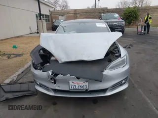 2017 Tesla Model S 60 with VIN 5YJSA1E17HF189627, listed as a IAAI auction lot 41891766 with 106,003 mi miles and . Bid and sale history available at DreamBid. Image 13.