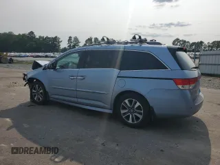 2014 Honda Odyssey Touring with VIN 5FNRL5H95EB080449, listed as a Copart auction lot 58489715 with 154,604 mi miles and Salvage title. Bid and sale history available at DreamBid. Image 2.