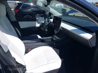 2022 Tesla Model Y Long Range with VIN 7SAYGAEEXNF381389, listed as a IAAI auction lot 41613075 with 52,800 mi miles and . Bid and sale history available at carsss.com. Image 5.