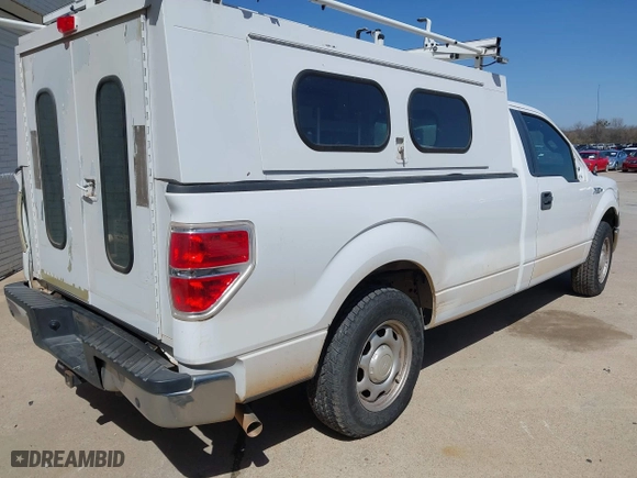 2014 Ford F-150 XL with VIN 1FTMF1CM4EKG22844, listed as a IAAI auction lot 41669259 with 242,141 mi miles. Bid and sale history available at carsss.com. Image 4.
