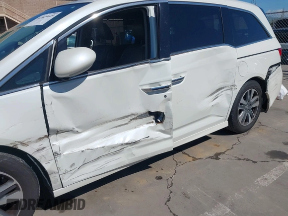 2015 Honda Odyssey Touring Elite with VIN 5FNRL5H91FB038099, listed as a IAAI auction lot 41829649 with 167,017 mi miles and . Bid and sale history available at DreamBid. Image 6.
