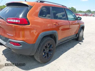 2016 Jeep Cherokee Trailhawk with VIN 1C4PJMBS6GW318035, listed as a IAAI auction lot 42652034 with 187,519 mi miles and . Bid and sale history available at DreamBid. Image 4.