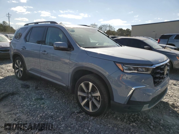 2024 Honda Pilot Touring with VIN 5FNYG2H79RB004803, listed as a Copart auction lot 49702415 with 27,406 mi miles and Salvage title. Bid and sale history available at DreamBid. Image 4.