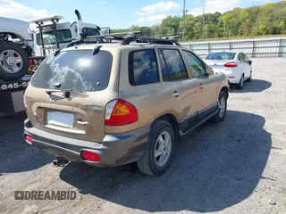 2004 Hyundai Santa Fe GLS z VIN KM8SC73EX4U814067, wystawiony jako IAAI lot #40404373 z przebiegiem 182 101 mil mil oraz . Historia ofert i sprzedaży dostępna na DreamBid. Obrazek 4.