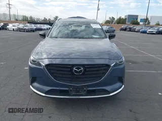 2021 Mazda CX-9 Grand Touring with VIN JM3TCADY1M0519288, listed as a IAAI auction lot 41186094 with 50,701 mi miles and . Bid and sale history available at DreamBid. Image 13.