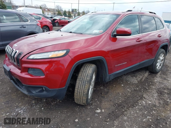 2014 Jeep Cherokee Latitude with VIN 1C4PJMCS0EW261021, listed as a IAAI auction lot 41986701 with 114,633 mi miles. Bid and sale history available at carsss.com. Image 2.