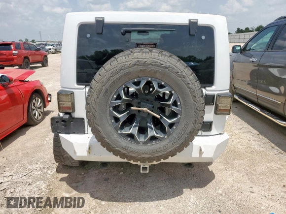 2015 Jeep Wrangler Unlimited Sport with VIN 1C4BJWDG9FL759012, listed as a Copart auction lot 61002465 with 101,395 mi miles and Salvage title. Bid and sale history available at DreamBid. Image 6.