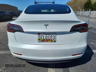 2020 Tesla Model 3 Long Range with VIN 5YJ3E1EBXLF795059, listed as a IAAI auction lot 42133884 with 58,841 mi miles and . Bid and sale history available at DreamBid. Image 1.